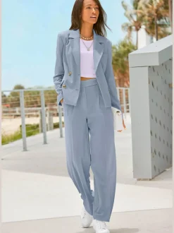 Blazer court à col à revers avec manches longues et poches