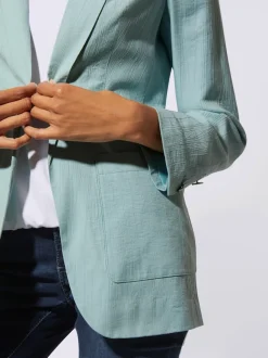 Blazer légèrement brillant avec col châle et manches longues