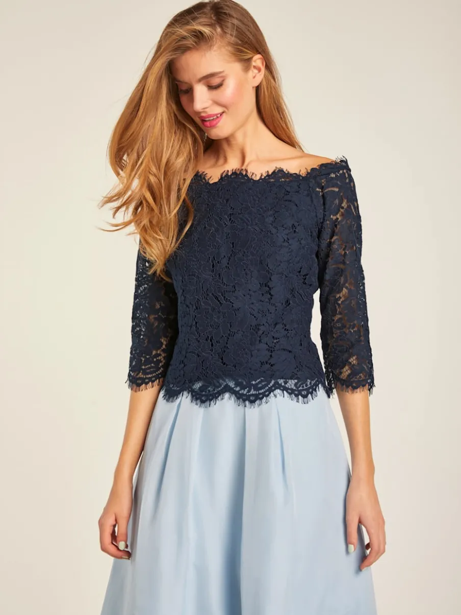 Blouse en dentelle raffinée à manches trois quarts
