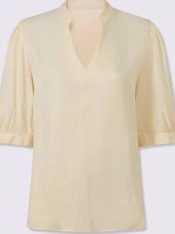 Blouse féminine à manches bouffantes et col montant