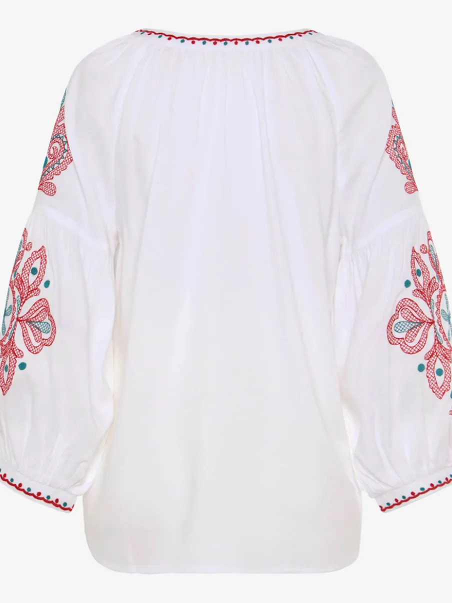 Blouse à manches larges avec broderie et houppes décoratives