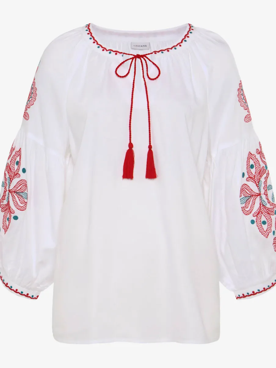 Blouse à manches larges avec broderie et houppes décoratives