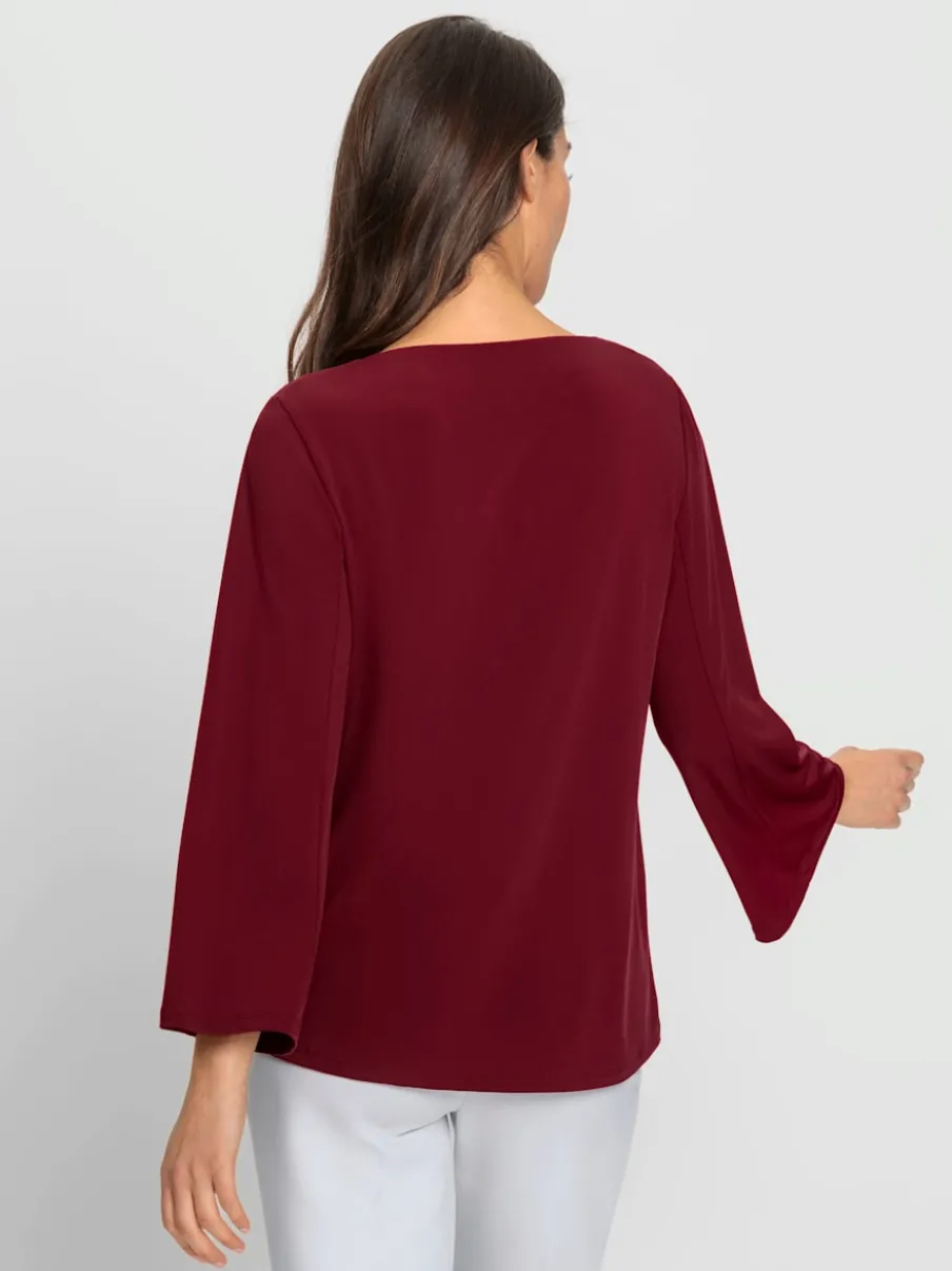 Blouse à manches trompette détails anneau fantaisie fluide