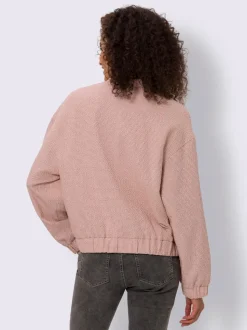 Blouson en bouclé avec petit col montant et poches