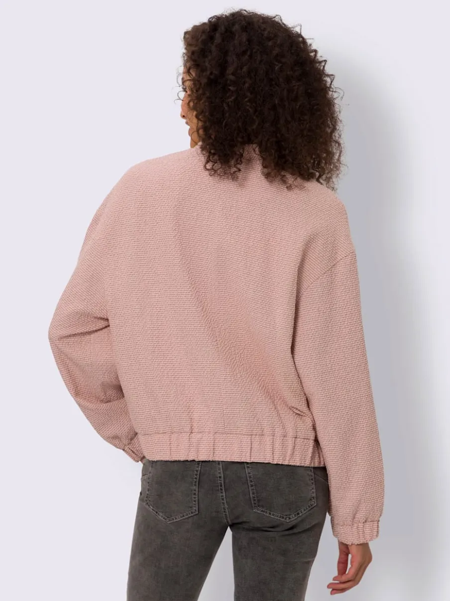 Blouson en bouclé avec petit col montant et poches