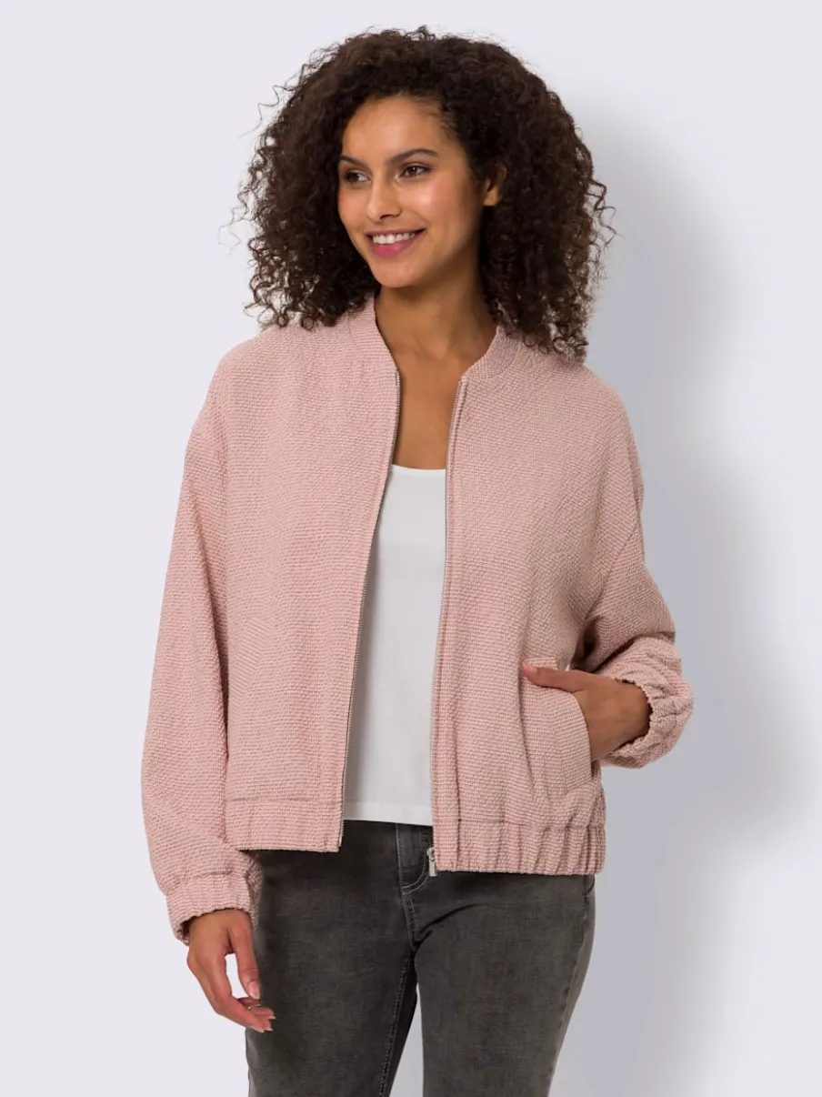 Blouson en bouclé avec petit col montant et poches