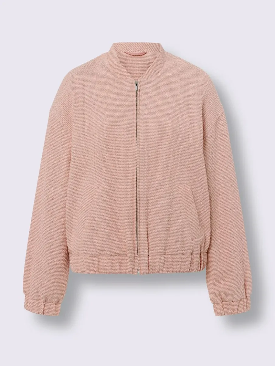 Blouson en bouclé avec petit col montant et poches