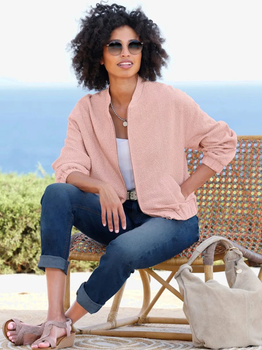 Blouson en bouclé avec petit col montant et poches