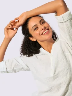 Chemisier en coton à encolure V et manches retroussables avec motif brodé