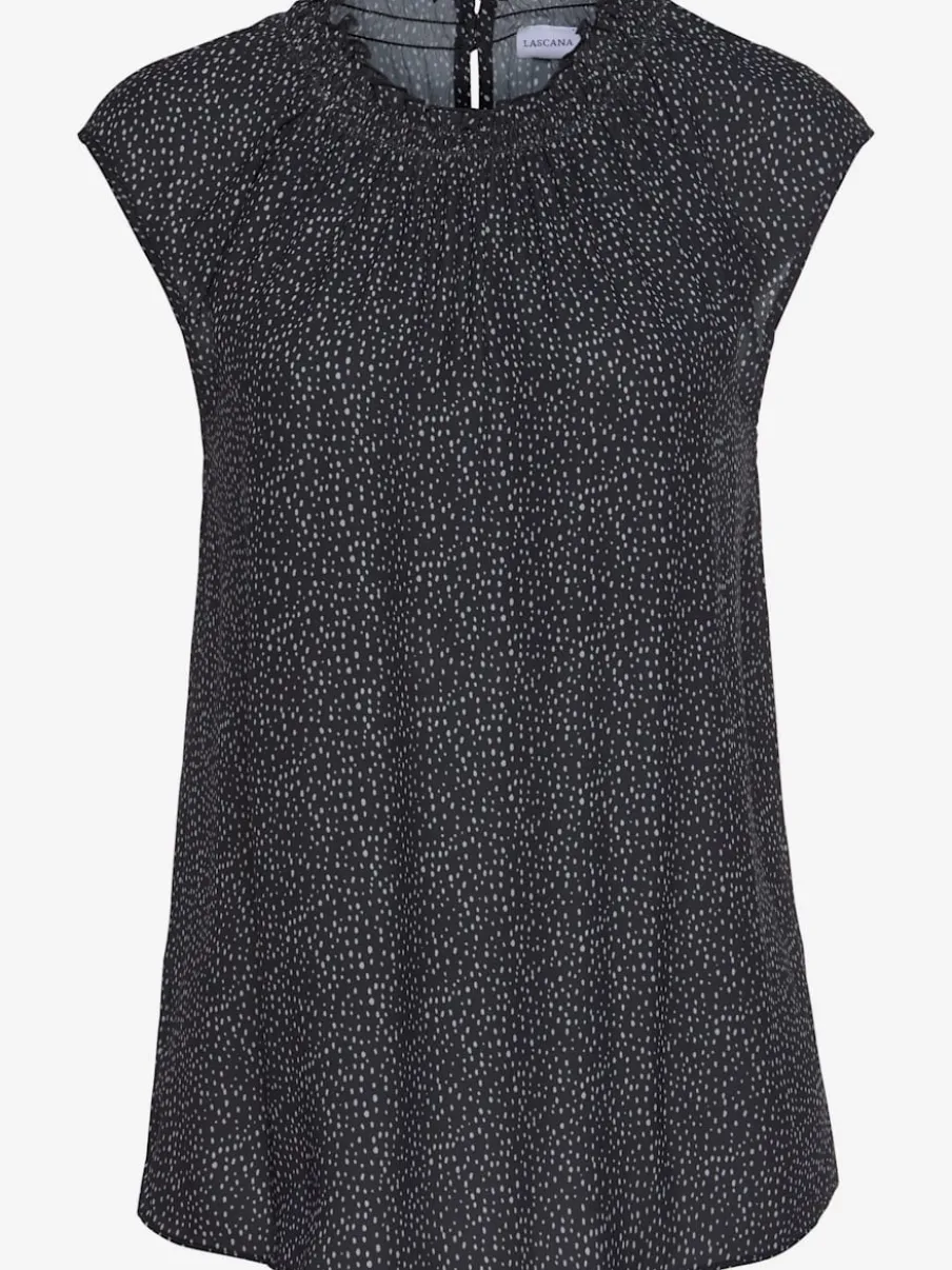 Chemisier à manches courtes avec encolure froncée et motifs à pois