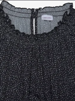 Chemisier à manches courtes avec encolure froncée et motifs à pois
