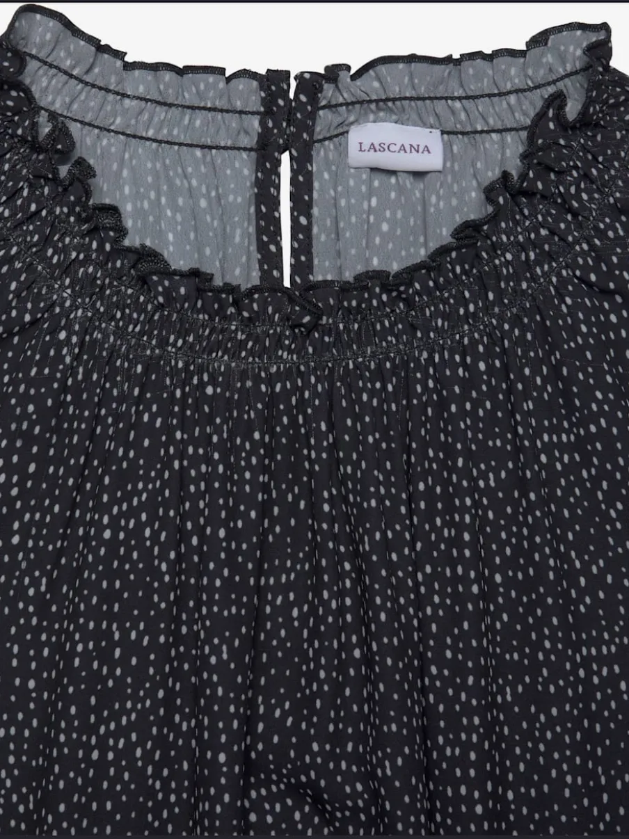 Chemisier à manches courtes avec encolure froncée et motifs à pois