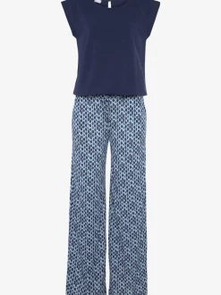 Combinaison avec col arrondi et manches courtes en viscose fluide à jambes extra-larges et poches fendues