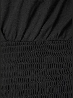 Combinaison col V effet cache-cœur à bretelles et jambes amples