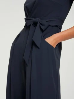 Combinaison à jambes larges avec ceinture ajustable fluide