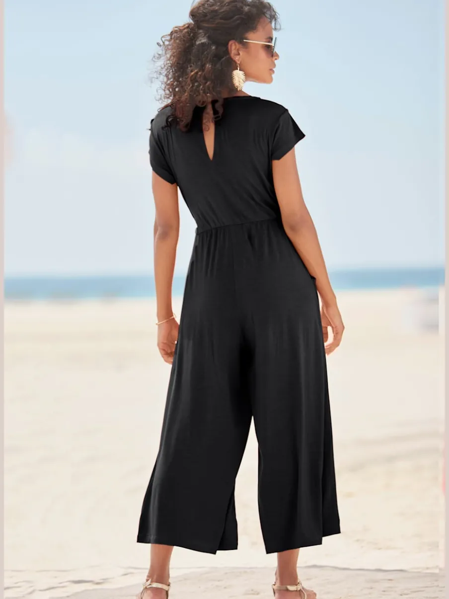 Combinaison pantalon large avec encolure ronde et poches latérales