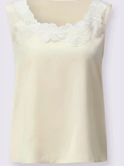 Débardeur en satin avec encolure en dentelle raffinée.