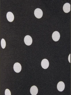 Débardeur à pois avec encolure fendue et sans manches