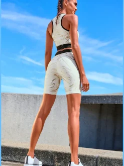 Hauts techniques courts avec glissière et ceinture élastique