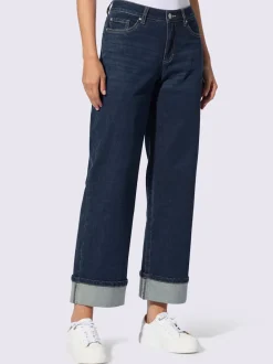 Jean cinq poches avec revers fixe jambes larges