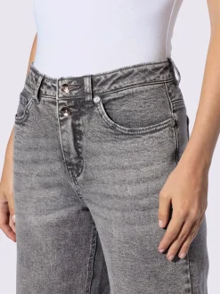 Jean coupe droite cinq poches avec rivets décoratifs