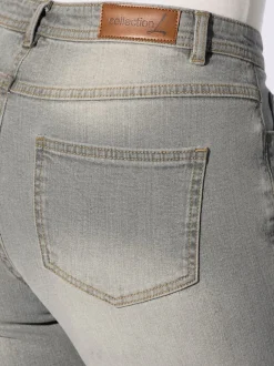 Jean effet délavé avec poches et ceinture gainante
