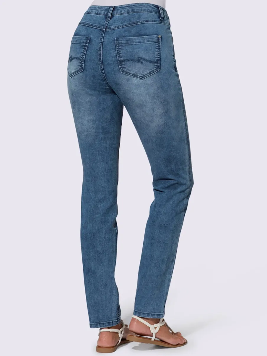 Jean extensible cinq poches avec rivets décoratifs arrière