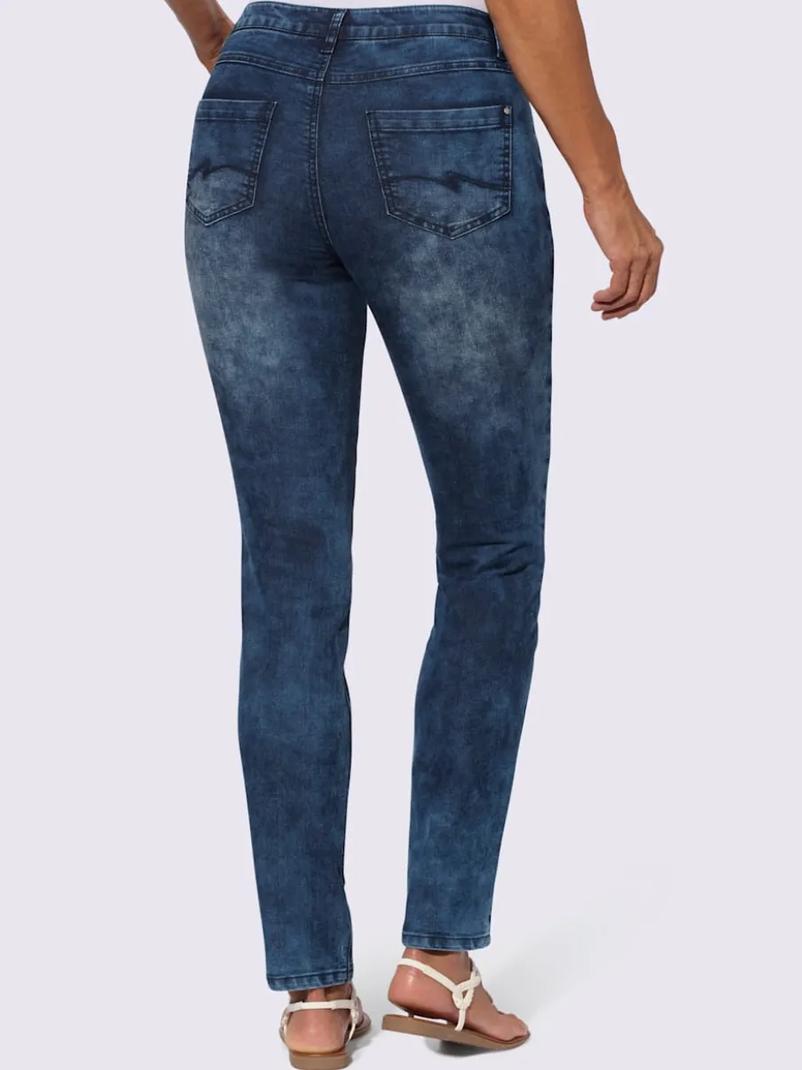 Jean extensible cinq poches avec rivets décoratifs arrière