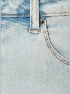 Jean longueur cheville avec coupe barrel et poches arrière