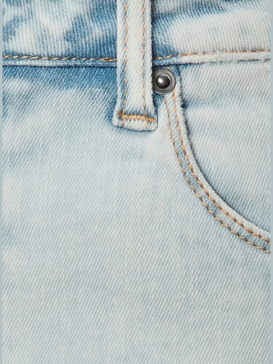 Jean longueur cheville avec coupe barrel et poches arrière