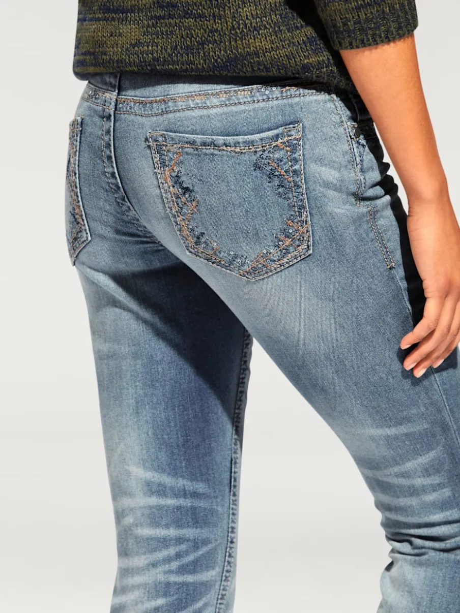 Jean skinny avec broderie et effet ventre plat