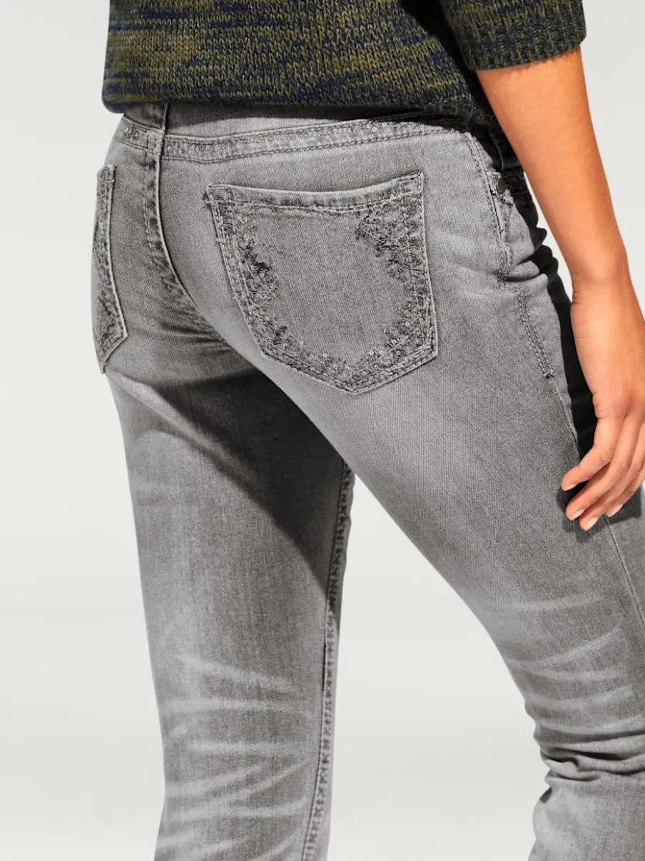 Jean skinny avec broderie et effet ventre plat