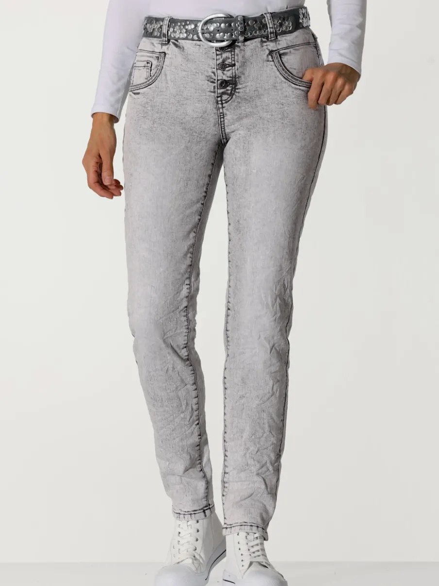 Jean skinny effet délavé avec broderies et boutons fantaisie