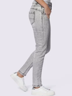 Jean skinny effet délavé avec broderies et boutons fantaisie