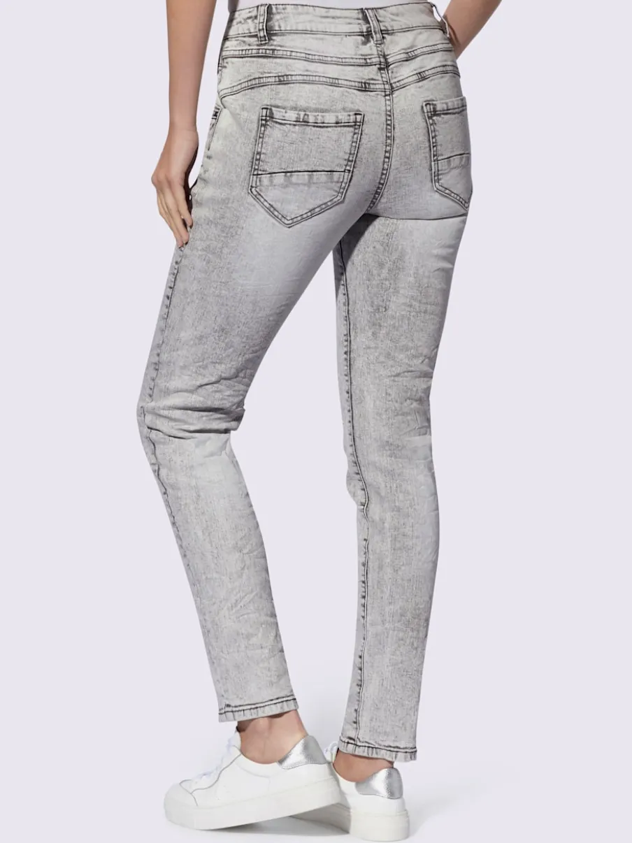 Jean skinny effet délavé avec broderies et boutons fantaisie