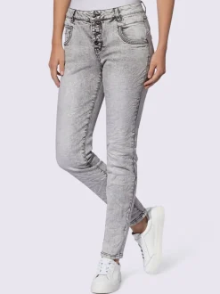 Jean skinny effet délavé avec broderies et boutons fantaisie