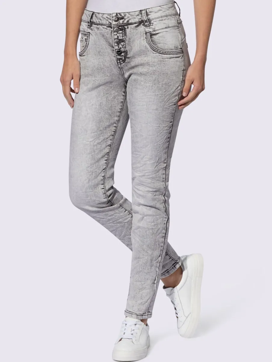 Jean skinny effet délavé avec broderies et boutons fantaisie