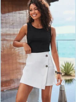 Jupe-culotte style skort avec effet cache-cœur décoratif