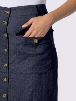 Jupe estivale en lin avec patte de boutonnage et poches.