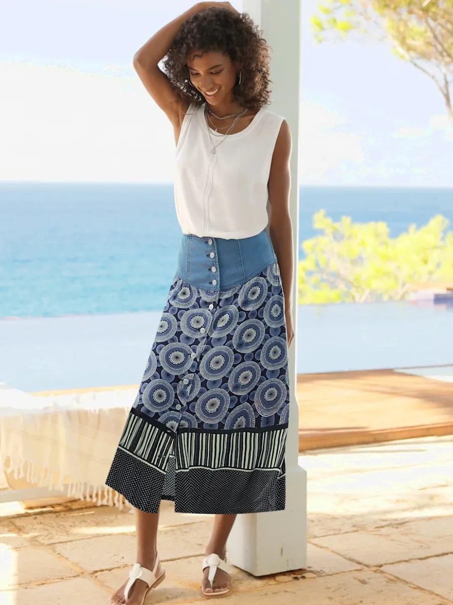 Jupe évasée en coton avec patte de boutonnage et poches