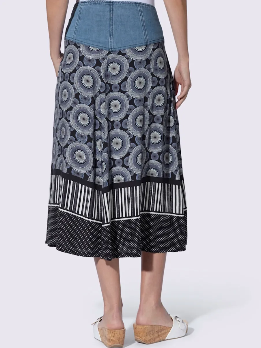 Jupe évasée en coton avec patte de boutonnage et poches