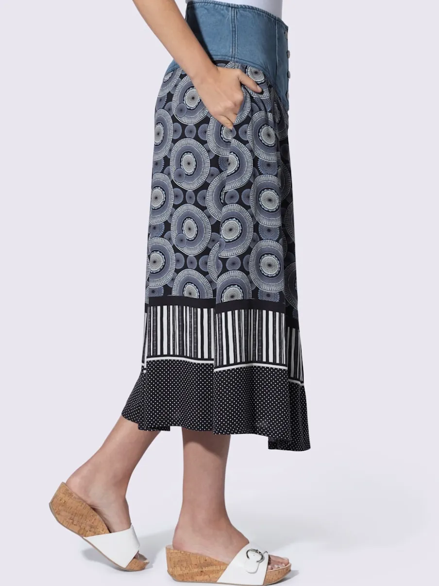 Jupe évasée en coton avec patte de boutonnage et poches