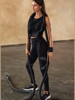 Leggings avec motifs réfléchissants et poche téléphone pratique