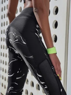 Leggings performance avec empiècements et poche ceinture