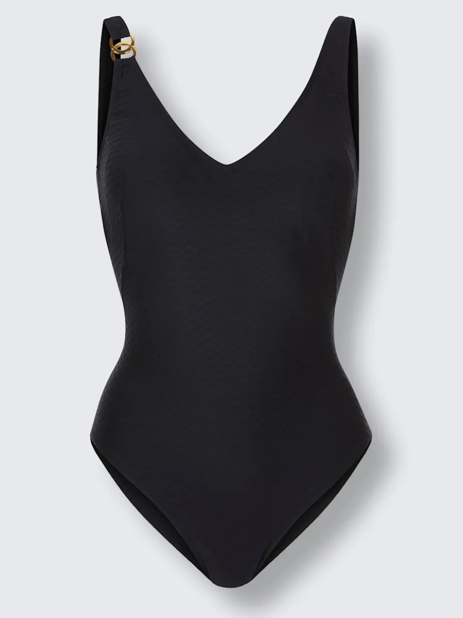 Maillot de bain avec broche dorée et bonnets doux