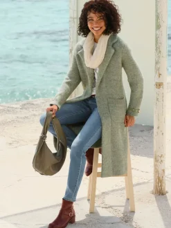 Manteau en tricot bride décorative à la finition des manches