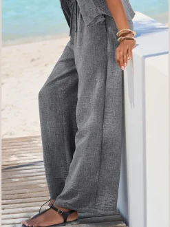 Pantalon ample avec ceinture et manches courtes en matière légère