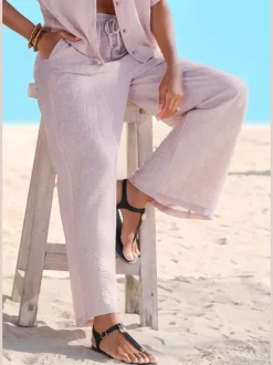 Pantalon ample avec ceinture et manches courtes en matière légère