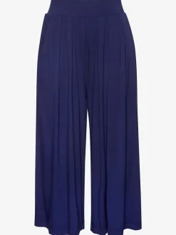 Pantalon avec large ceinture élastique et poches.