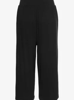 Pantalon avec large ceinture élastique et poches.